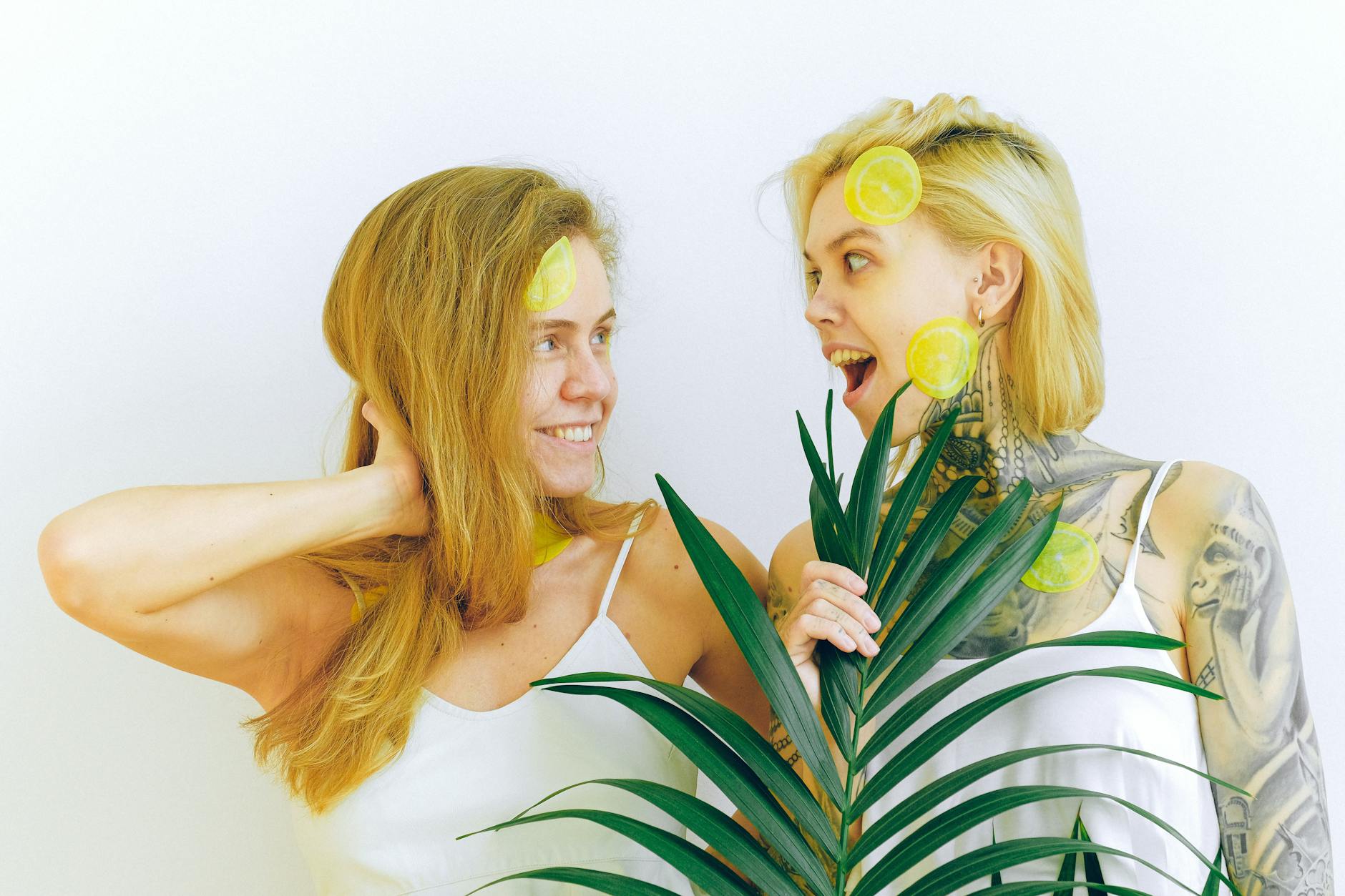 Two smiling women expressing joy and connection indoors